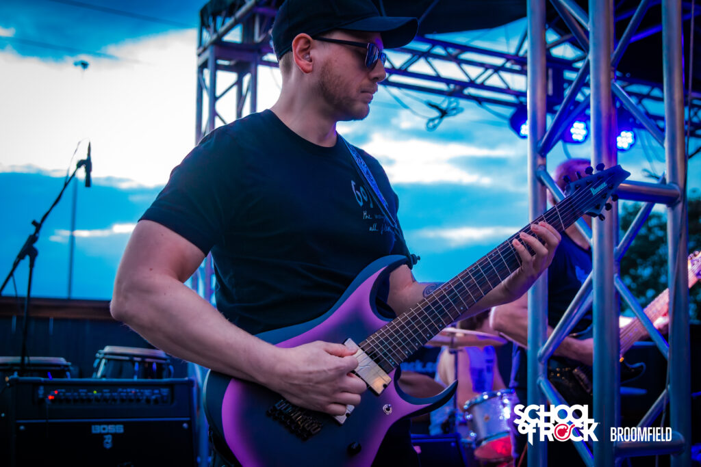Isaac Askew playing guitar at the Hellfest School of Rock Broomfield end season show